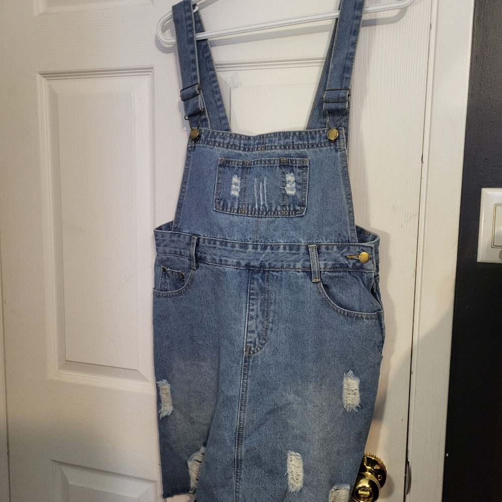Light blue denim overall skirt bottom lightly distressed Brand new, never worn